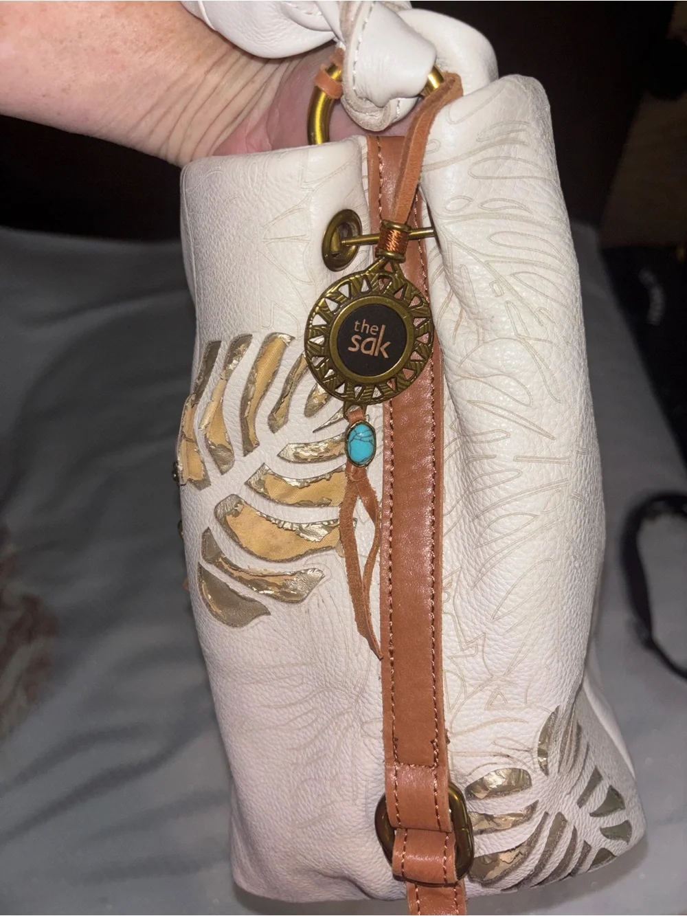 The Sak Cream Leather Shoulder Bag with Floral Cutout Accents